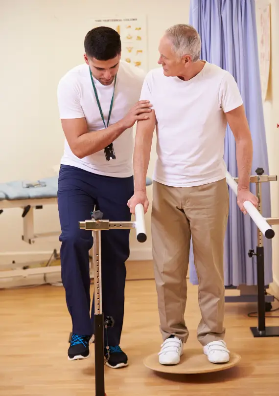 professional physical trainer helping to gain balance